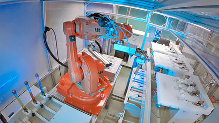 Photo of a robot with a pipette.